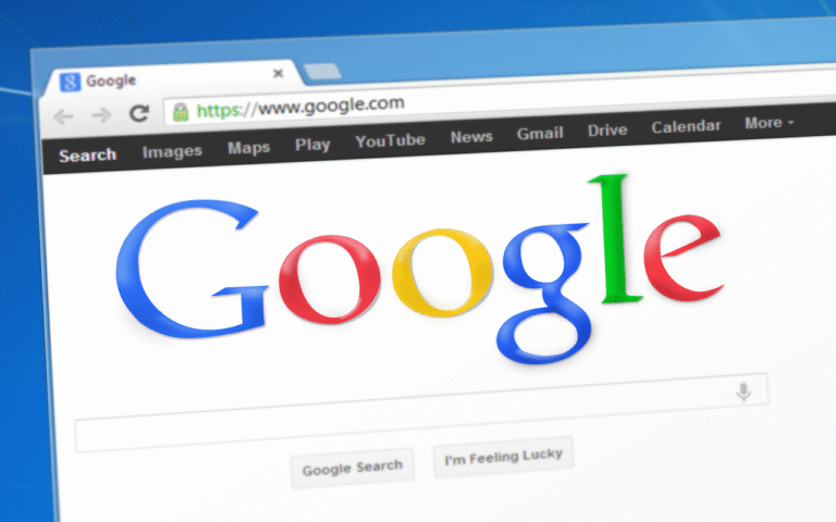 A marketer in India using Google Ads dashboard on a laptop, showing AI-generated ad suggestions and smart bidding features launched as part of Google AI ad tools India.