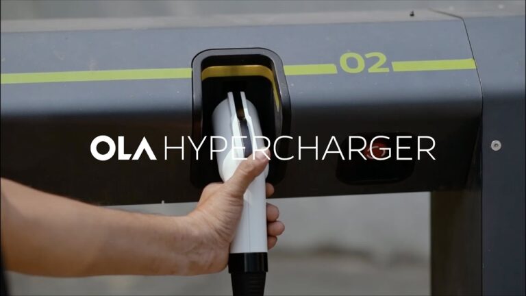 An Ola Hypercharger station in Chennai with an Ola S1 scooter plugged in, alongside an app interface showing real-time charging status, symbolizing rapid EV infrastructure deployment.